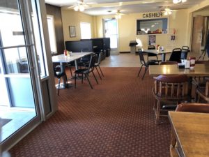 An abundance of well-lit cafe seating at North South Truck Stop Cafe