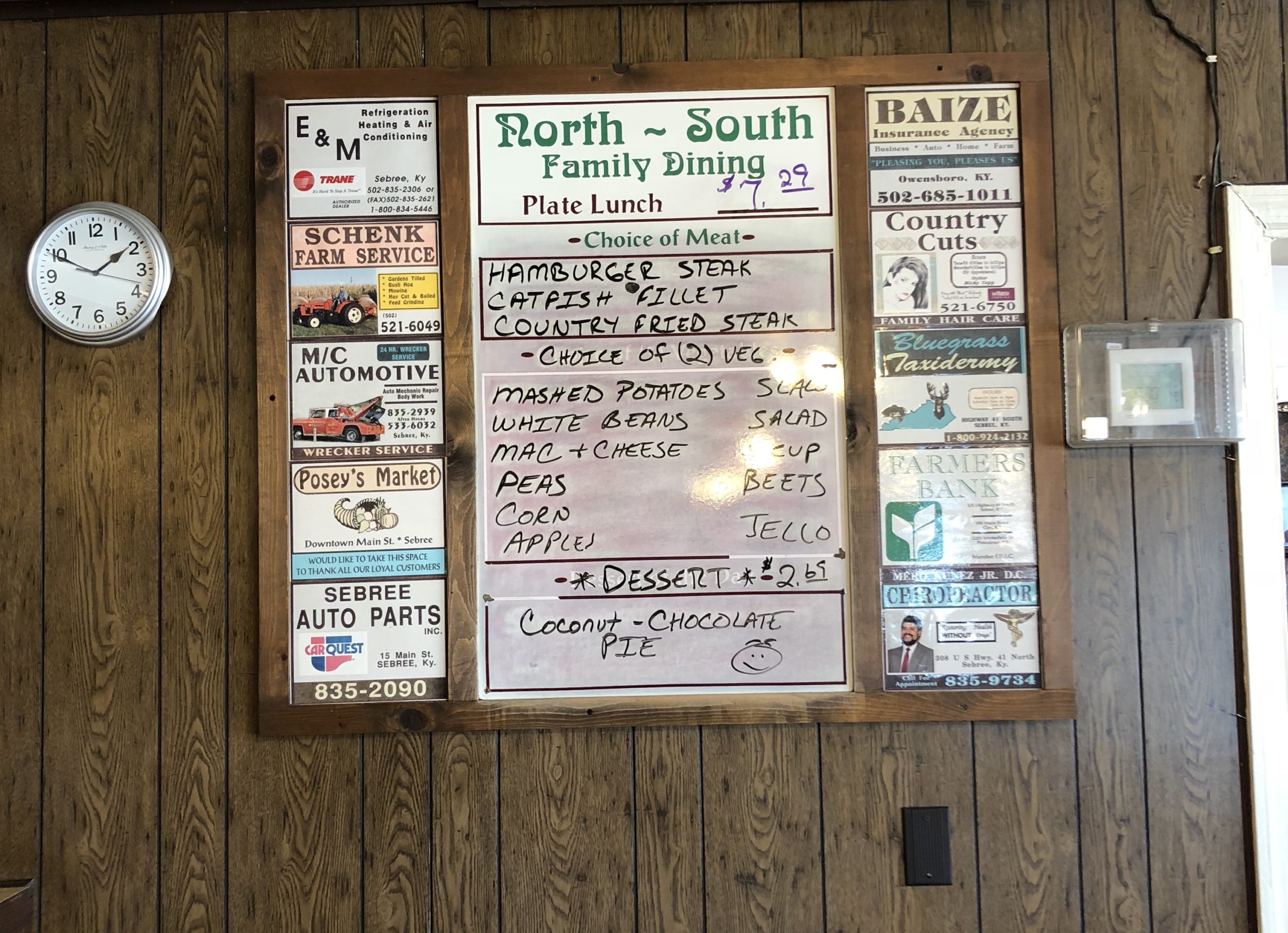 The old-fashioned board of daily specials at North South including a plate lunch for $7.29