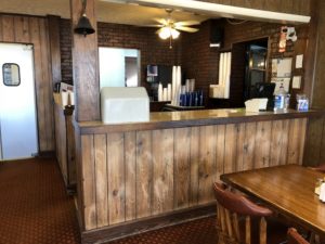 Details of brick and wood veneer at North South Truck Stop Cafe