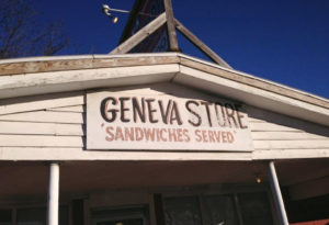 Hand painted sign reading, "Geneva Store, Sandwiches Served," photo by Brad Staton